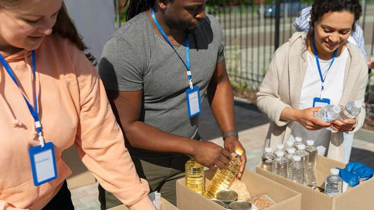 volunteers handing out food and water